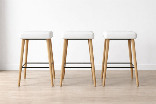 Set of 3 White Faux Leather Stools with Beech Wood Legs and Metal Footrest